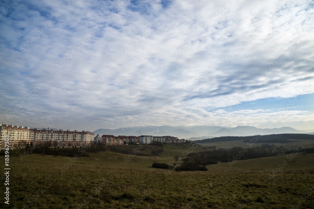 Fototapeta premium Meadow with the view to the Zilina city. Slovakia