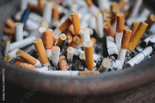 Close Up Many Waste Cigarette Butts in Ashtray