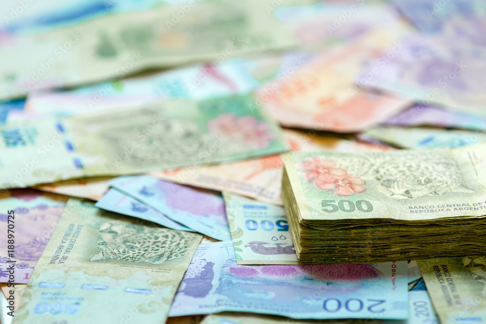 Macro close-up of 500 Argentine pesos banknotes stacked on bills of different value Macro close-up of 500 Argentine pesos banknotes stacked on bills of different value