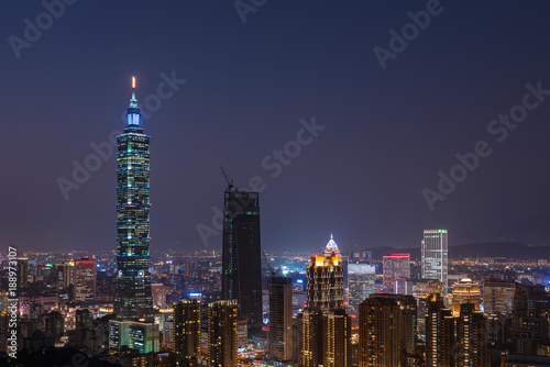 View of Taipei 101 building at night with city lights