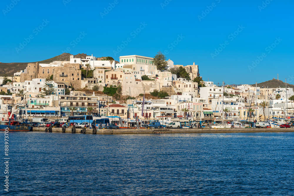 White houses of Naxos (Chora) town and boats in port on Naxos island. Greece