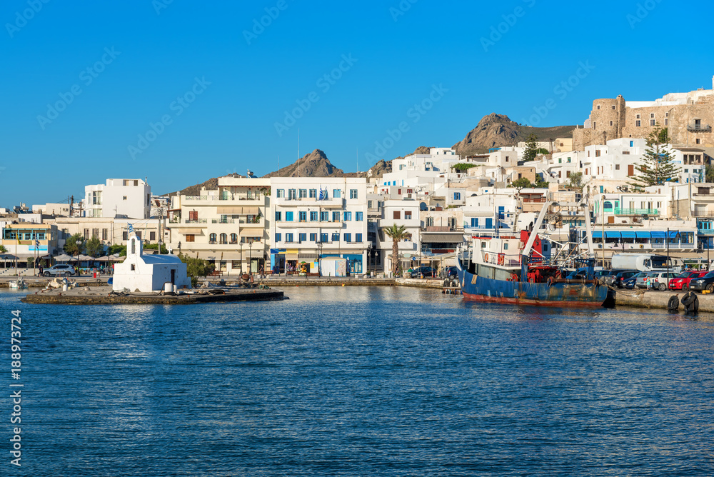 White houses of Naxos (Chora) town in port on Naxos island. Greece