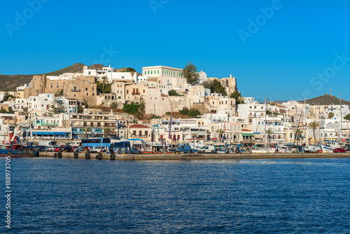 White houses of Naxos (Chora) town and boats in port on Naxos island. Greece