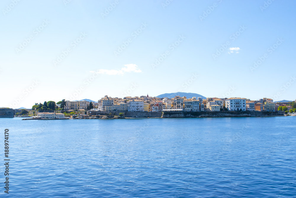 Panoramic view of Corfu island from water. Castle and old town