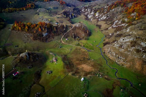 Fototapeta Naklejka Na Ścianę i Meble -  mountain landscape in autumn morning - Fundatura Ponorului, Romania - aerial view