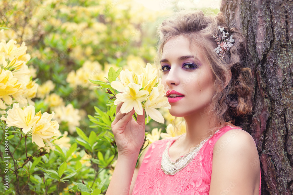 girl in dress in rhododendron garden girl in dress in rhododendron garden