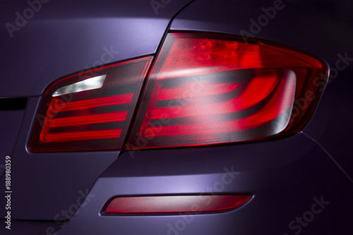 Stampa su Tela Car rear lights with matte surface, red backlights of lilac powerful sport sedan