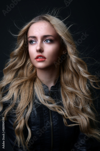 Portrait of a young blond woman with long healthy hair.