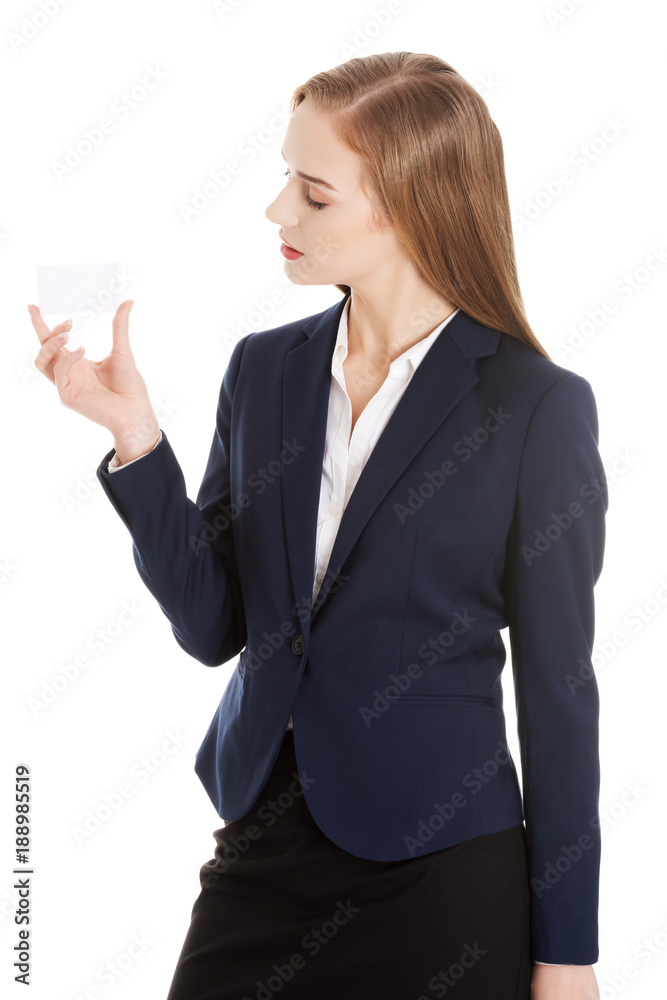 Beautiful caucasian business woman holding personal card. Beautiful caucasian business woman holding personal card.