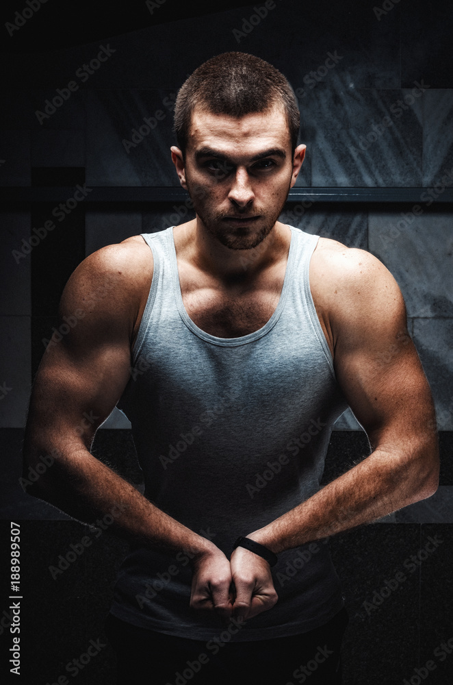 the guy is an athlete . beautiful body . doing exercise the guy is an athlete . beautiful body . doing exercise