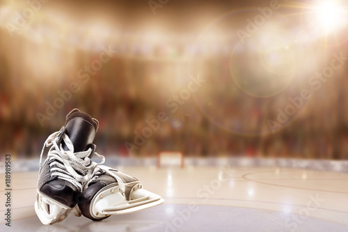 Canvas Print Ice Hockey Skates in Arena Rink With Copy Space