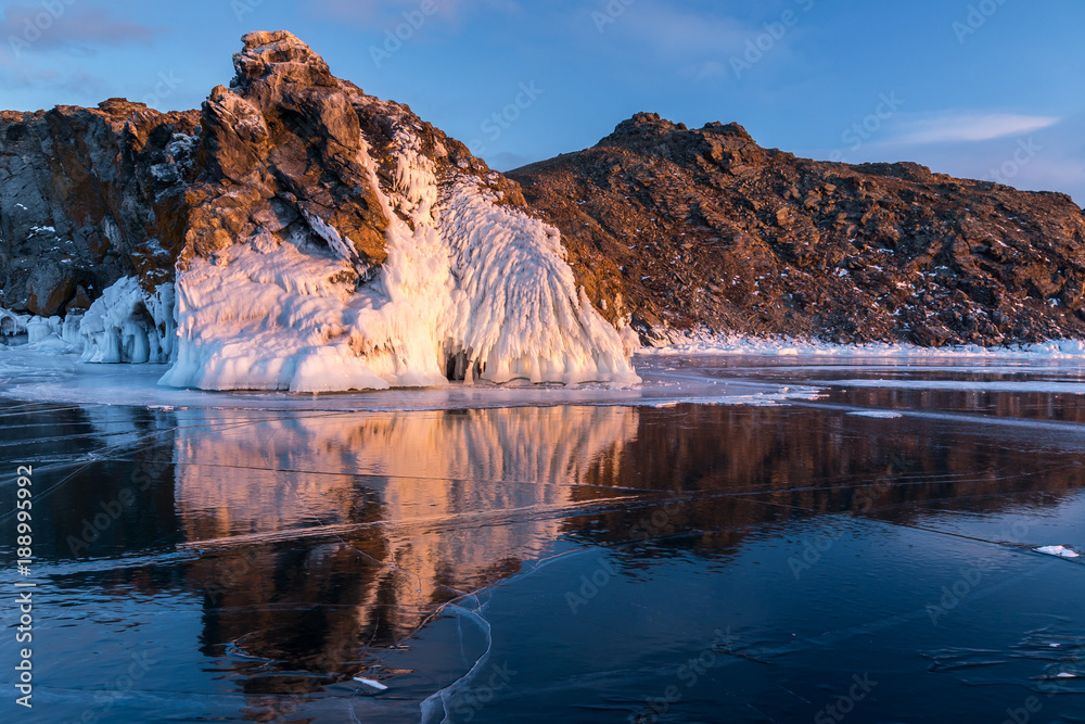 Reflection of the rock in the ice of Lake Baikal