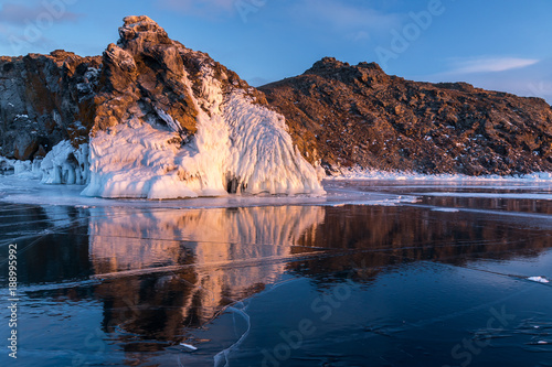 Reflection of the rock in the ice of Lake Baikal