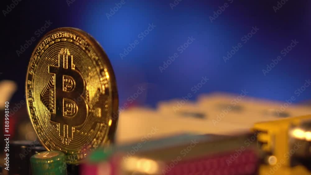 Cryptocurrency bitcoin gold. Bitcoins on the motherboard.A virtual business.