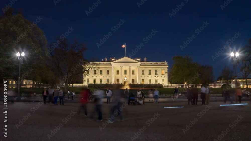 a night time lapse of tourists at the north side of the white house in washington d.c. a night time lapse of tourists at the north side of the white house in washington d.c.