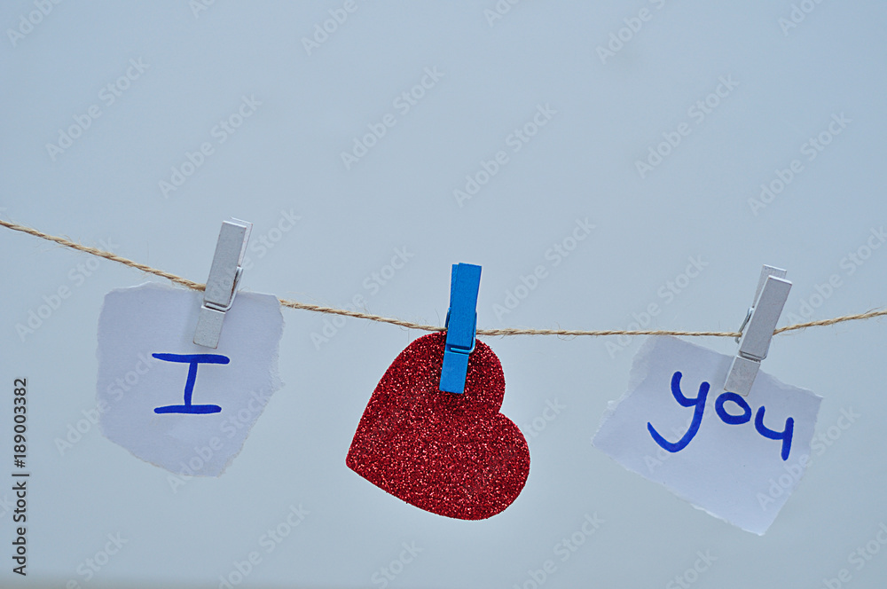 I love you hanging on a rope where love is replaced with a red heart I love you hanging on a rope where love is replaced with a red heart