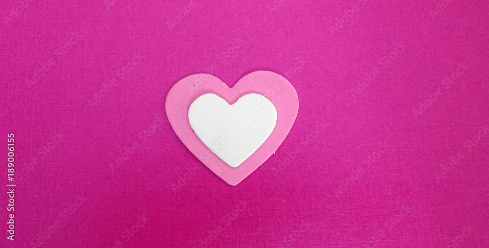 Pink and white heart on a pink background. 