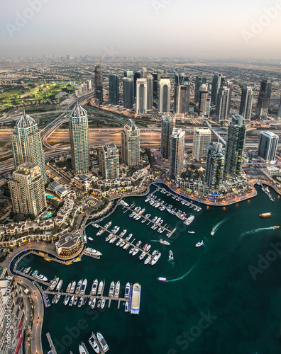 Rooftop aerial view of Dubai Marina district waterway during sunset. Dubai, UAE.
