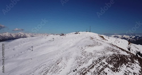Castione della Presolana, Italy. Drone aerial view of the people on the ski slopes and lift at Monte Pora ski resort photo