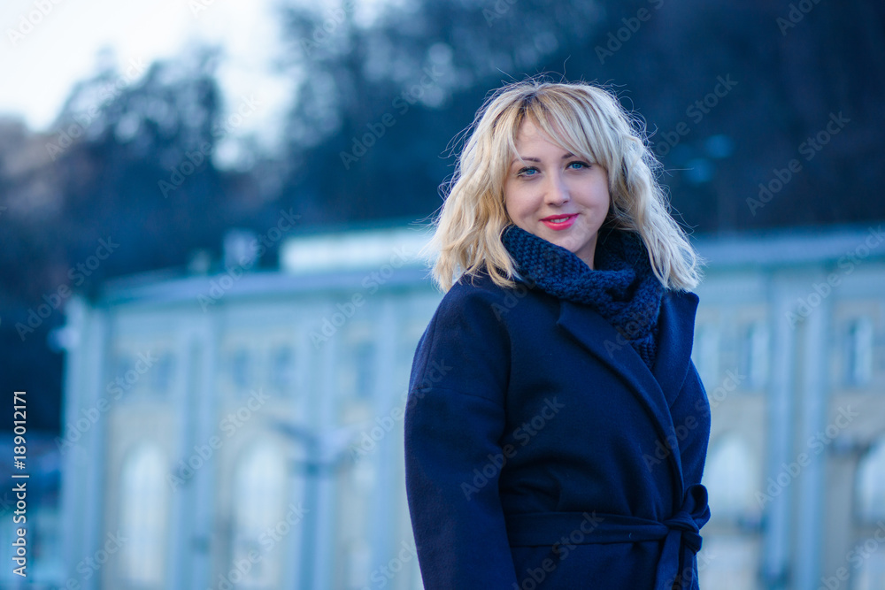 A pleasant smiling woman, citizen walks in a city with a good mood. Lifestyle of the inhabitants of the big city, their joy and sorrow. Walking on a fresh spring day and distraction from problems A pleasant smiling woman, citizen walks in a city with a good mood. Lifestyle of the inhabitants of the big city, their joy and sorrow. Walking on a fresh spring day and distraction from problems