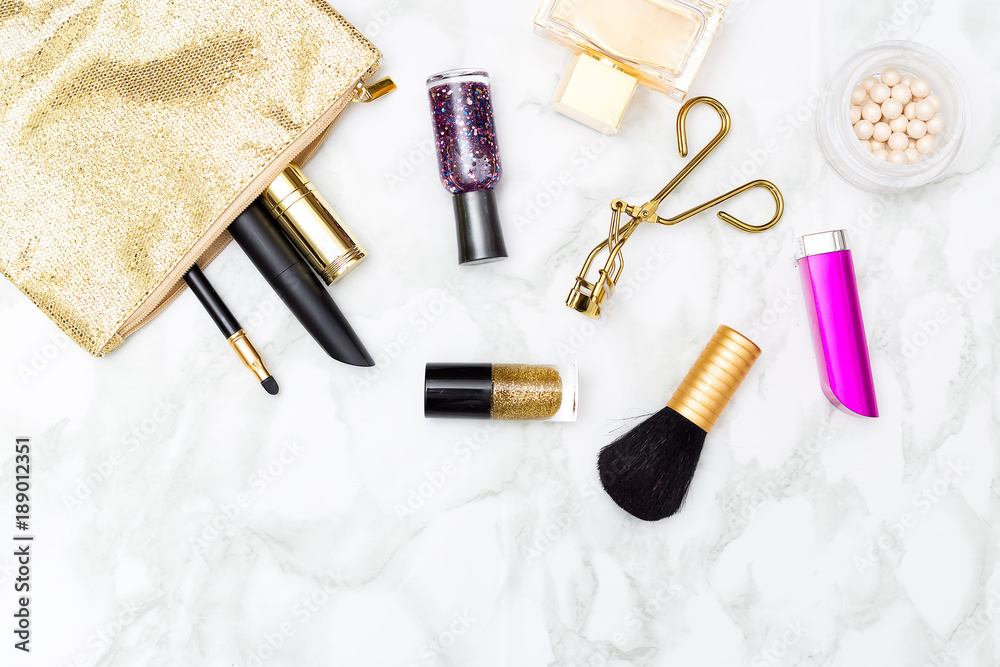 Cosmetics pink with gold on the table. Flat lay Cosmetics pink with gold on the table. Flat lay