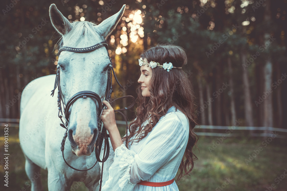 Beautiful young woman and horse