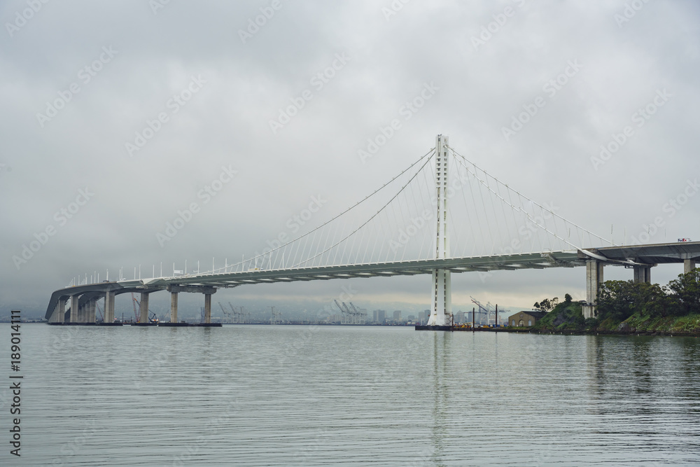 The beautiful San Francisco Oakland Bay Bridge in a cloudy day