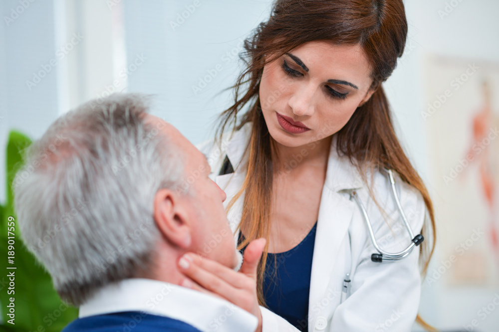 Fototapeta premium Doctor checking the lymph nodes size