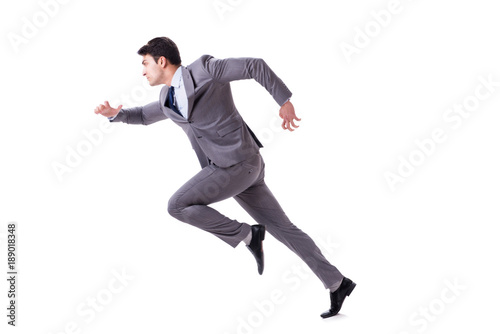 Young businessman running forward isolated on white