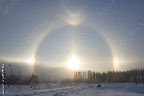 Halo effect on a winter day in Finland. Full circle  sparkling light.