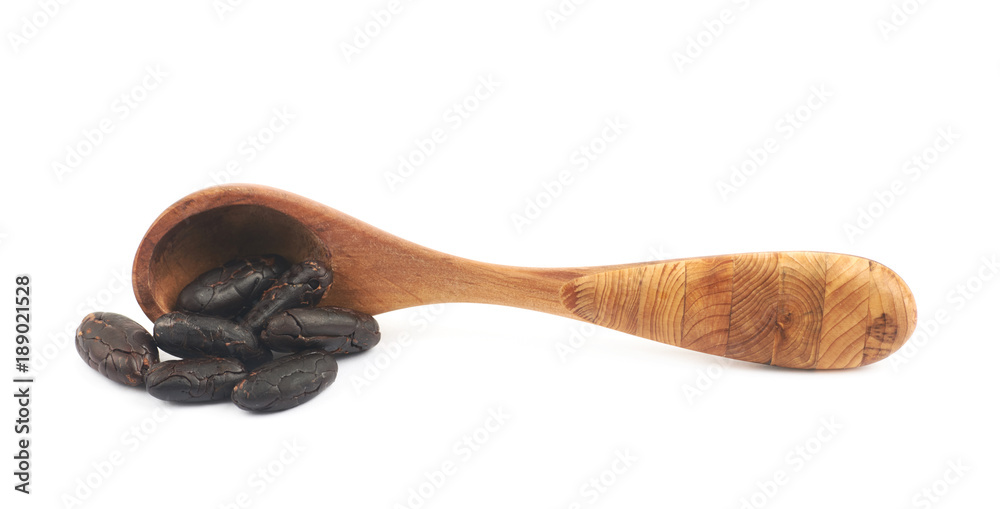 Wooden spoon of cocoa beans isolated Wooden spoon of cocoa beans isolated