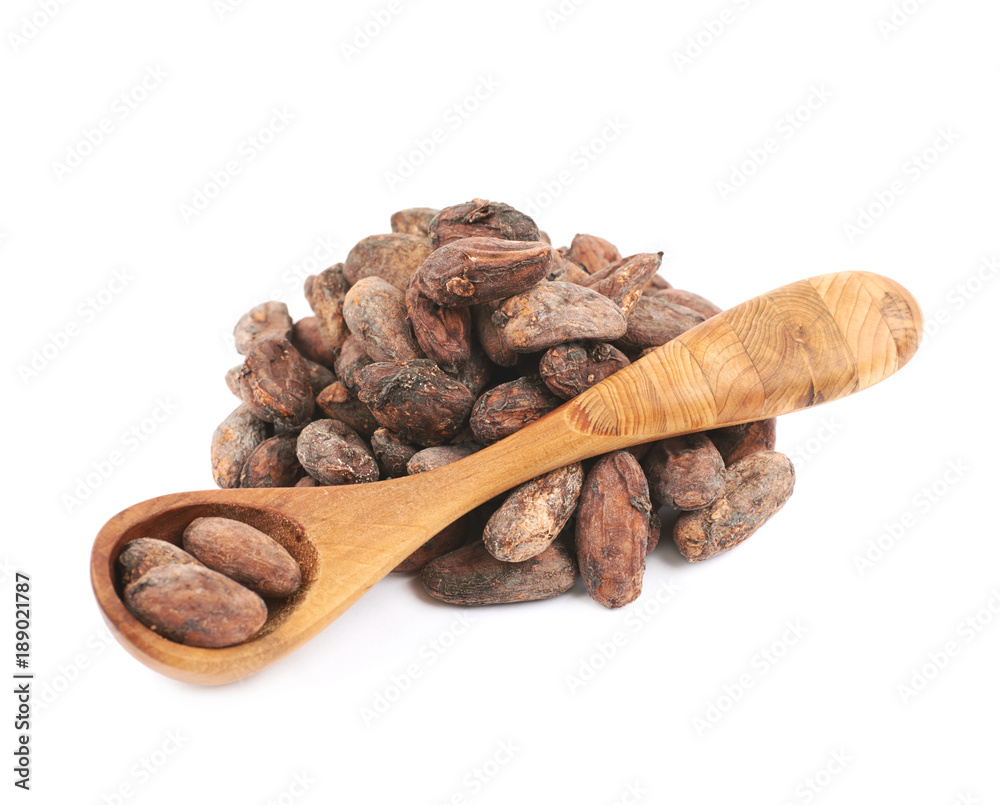 Wooden spoon of cocoa beans isolated
