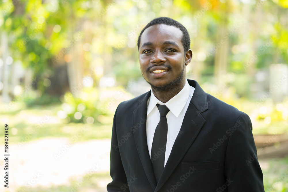 Portrait of smile african business man with the nature background. Portrait of smile african business man with the nature background.