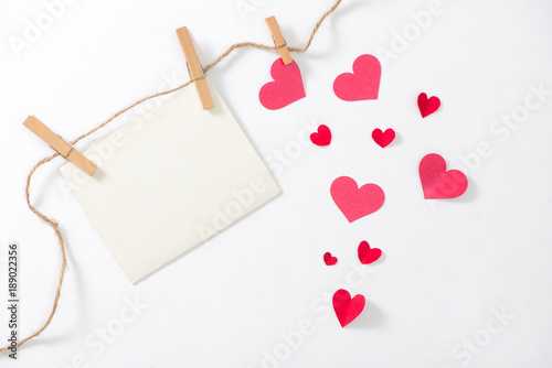 Valentine card with red heart and ribbon