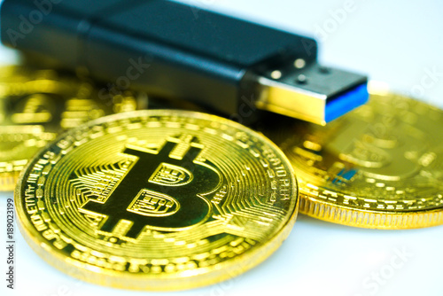 Golden bitcoin and USB flash drive