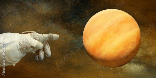 Fototapeta Naklejka Na Ścianę i Meble -  astronaut pointing to the planet Venus in natural colours