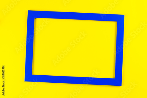 Blue color frame on bright yellow background.