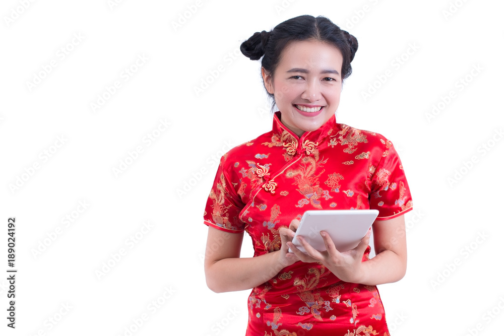 Beautiful Young asian woman wearing chinese dress traditional cheongsam or qipao. Hands holding and using laptop. Online shopping. Concept of buying digital online. Hand touching tablet, social media. Beautiful Young asian woman wearing chinese dress traditional cheongsam or qipao. Hands holding and using laptop. Online shopping. Concept of buying digital online. Hand touching tablet, social media.