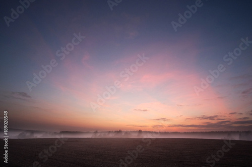 sunset and fog in the field