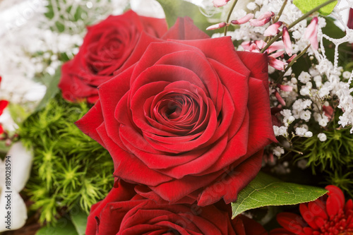 Closeup of very beautiful bridal bouquet with red rose
