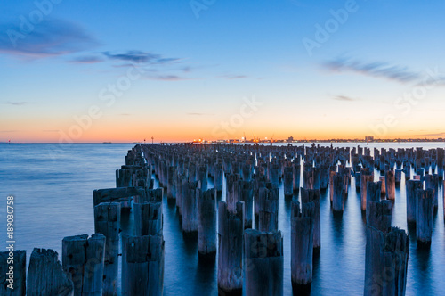 Old jetty pylons at dusk