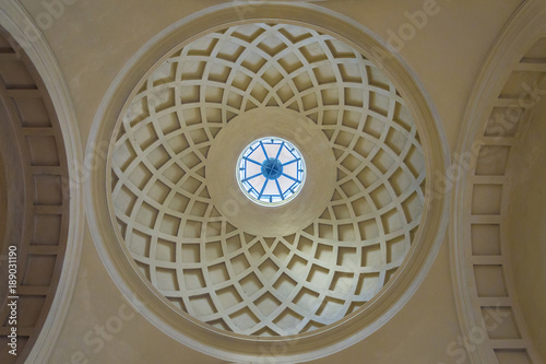 Circular interior of an ancient church concrete dome with natural light