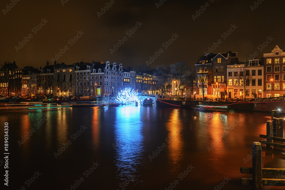 Tunnel of light under the bridge towards the Herengracht during the Festival of Light in Amsterdam