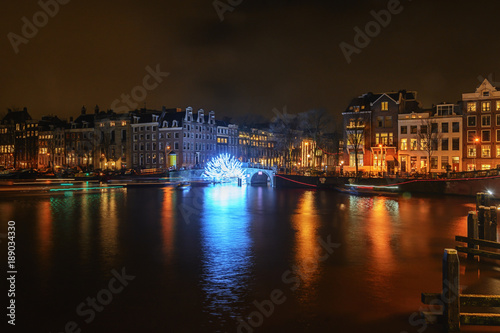 Tunnel of light under the bridge towards the Herengracht during the Festival of Light in Amsterdam