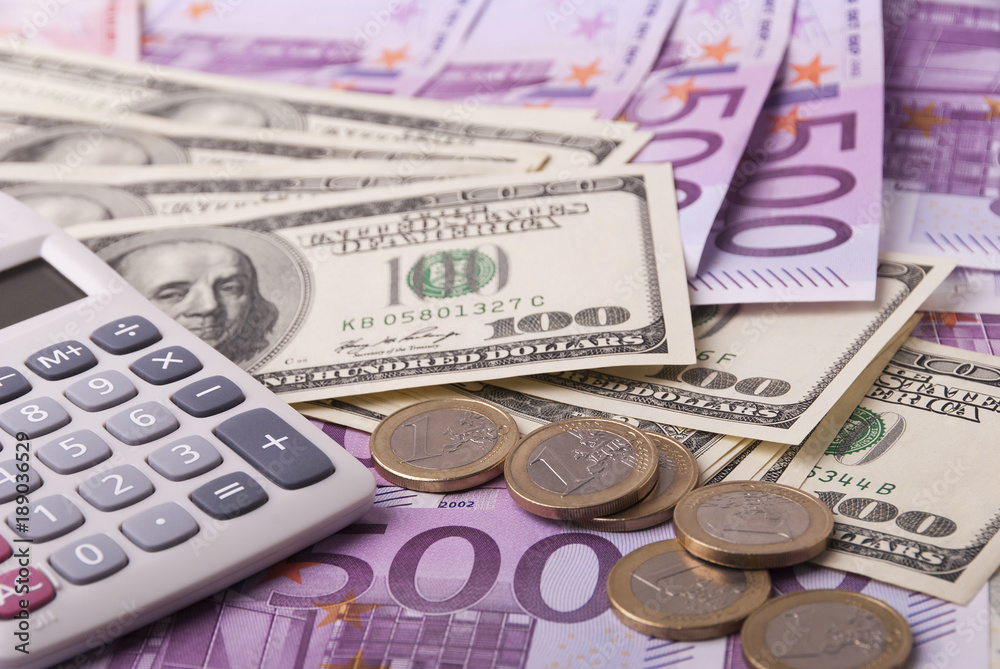 Dollar, euro banknotes, coins, calculator Dollar, euro banknotes, coins, calculator