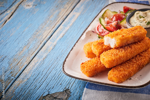 Sticker Tasty oven baked fish fingers with salad