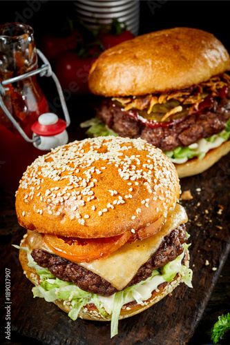 Traditional beef burger or cheeseburger on a bun
