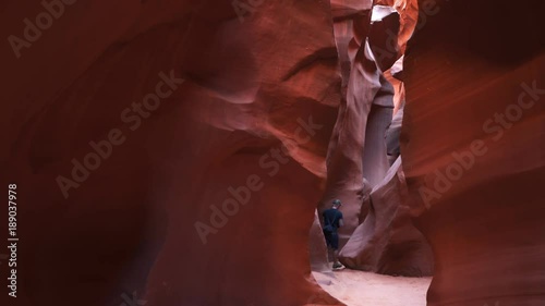 a photographer takes a shot in lower antelope canyon in page, arizona