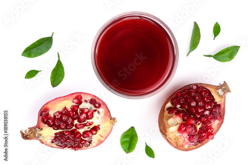 A glass of pomegranate juice with fresh pomegranate fruits isolated on white background. Top view. Flat lay