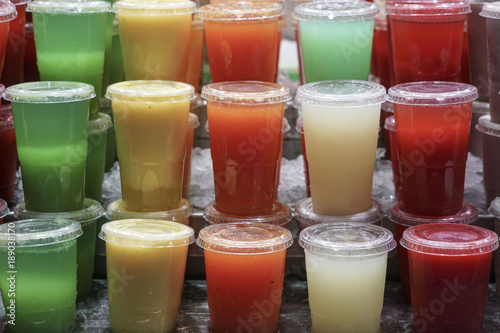 Variety of fruit juices in plastic glass for take away